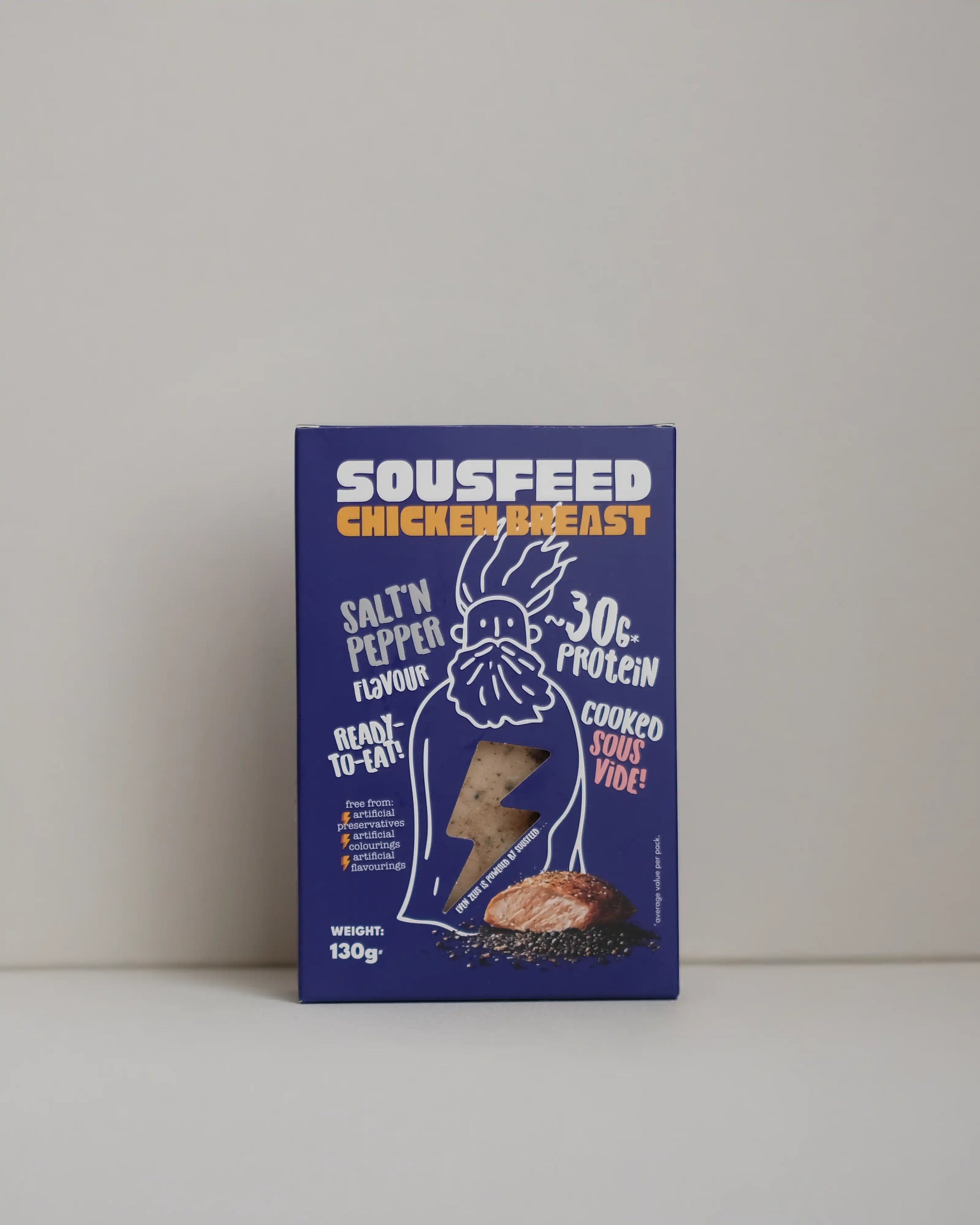 Front view of a SousFeed Salt and Pepper flavoured chicken breast and its purple packaging on a white background