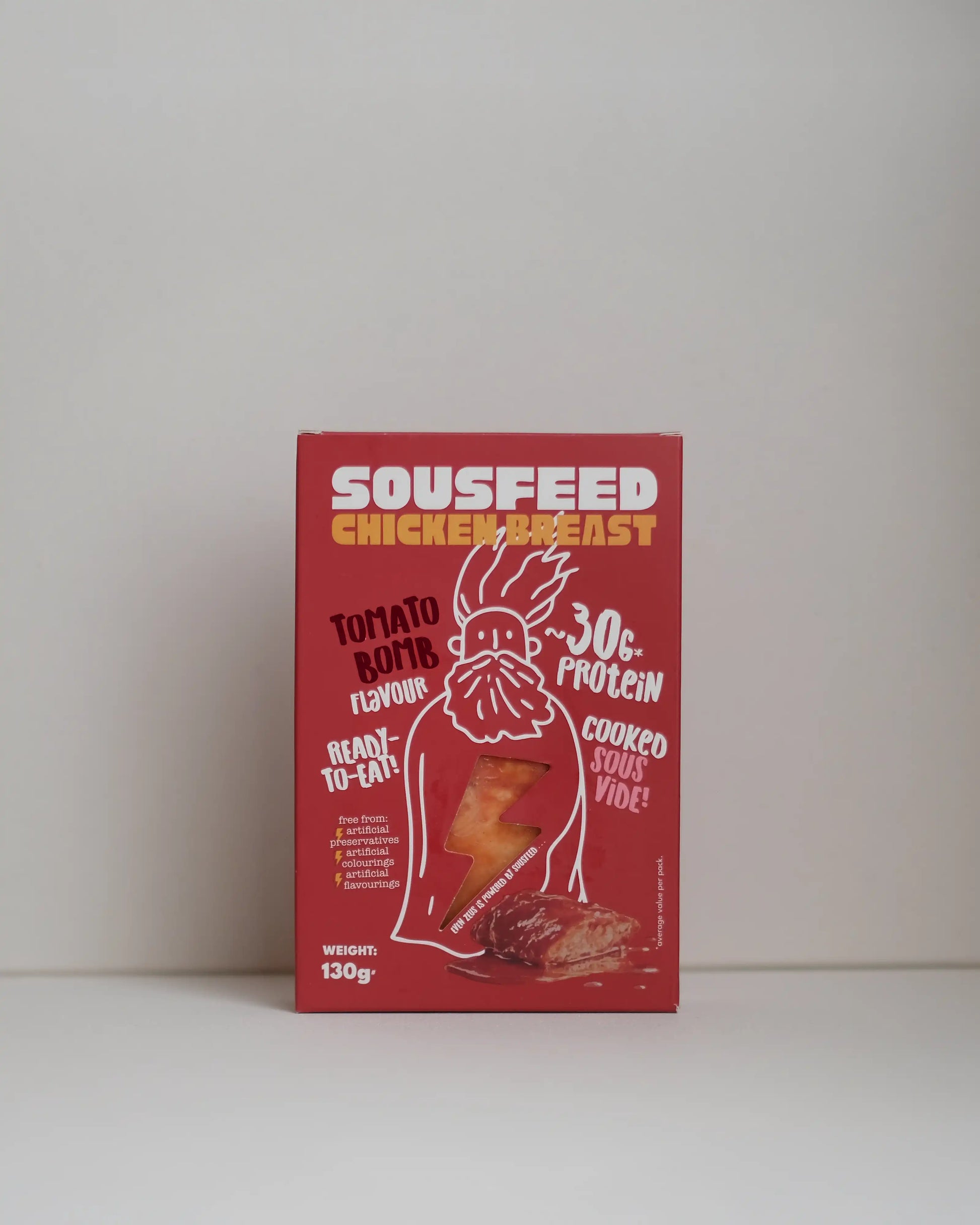 Front view of a SousFeed tomato bomb flavoured chicken breast and its packaging on a white background
