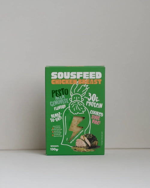 Front view of a SousFeed pesto alla genovese flavoured chicken breast and its light green packaging on a white background