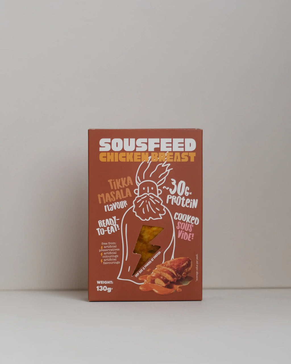 Front view of a SousFeed tikka masala  flavoured chicken breast and its amber packaging on a white background