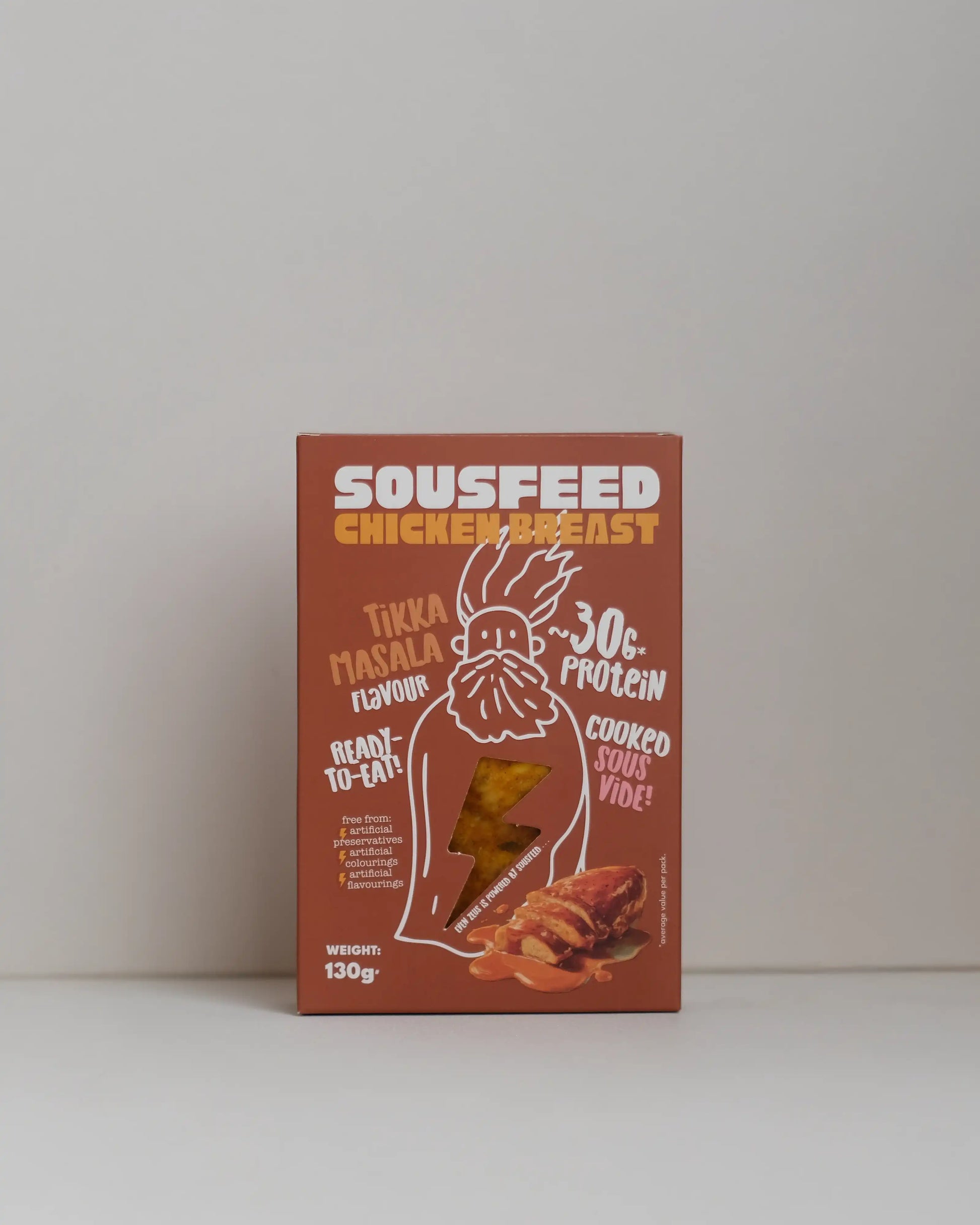 Front view of a SousFeed tikka masala  flavoured chicken breast and its amber packaging on a white background