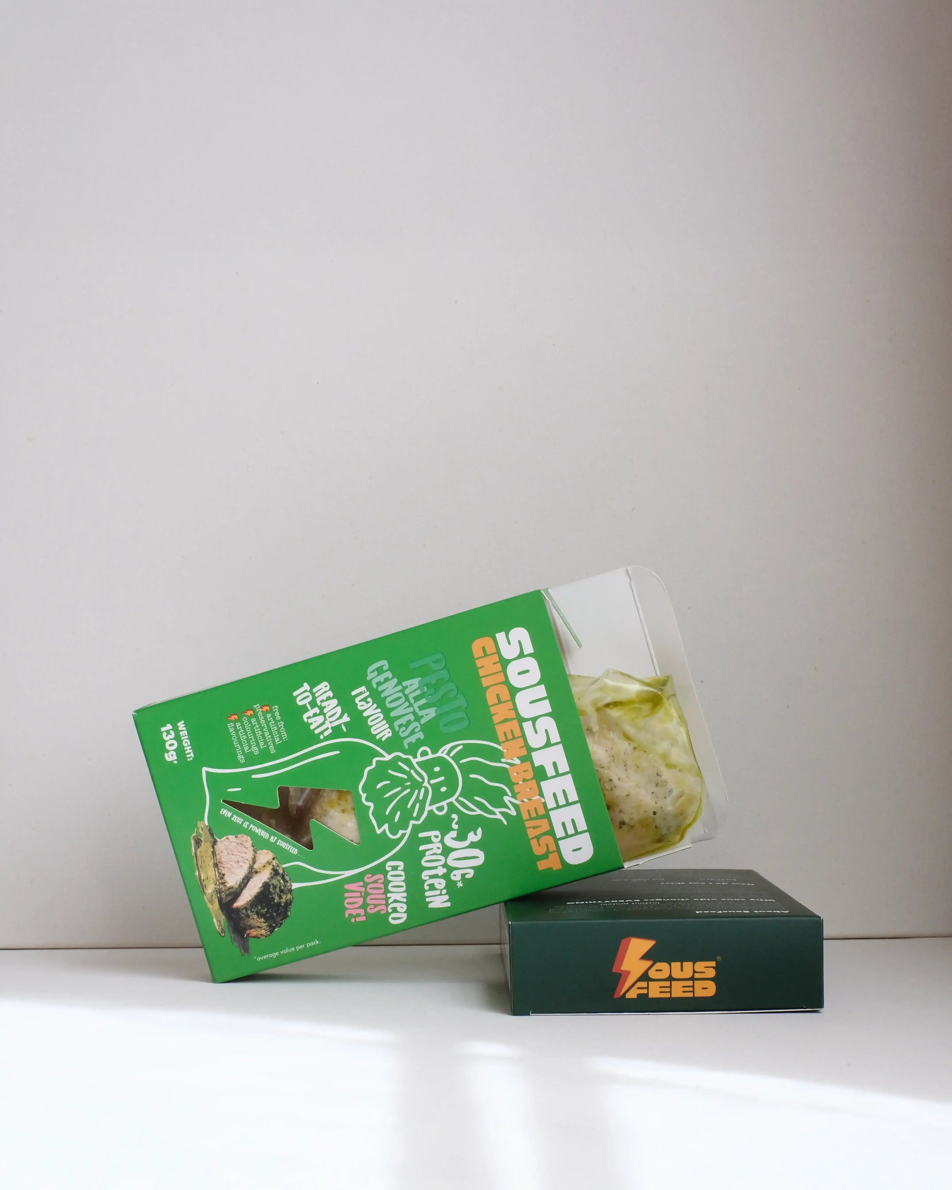 Sousfeed pesto alla genovese flavoured chicken breast with its packaging on a white background